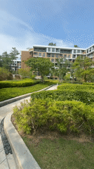 Landscaped pathway with greenery documented in Choeng Thale, Thailand