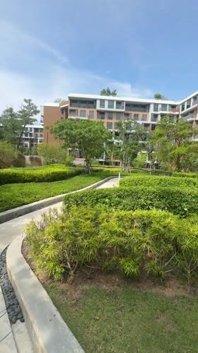 Landscaped pathway with greenery documented in Choeng Thale, Thailand