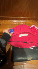 Lip-shaped piñatas handled indoors in Buenos Aires