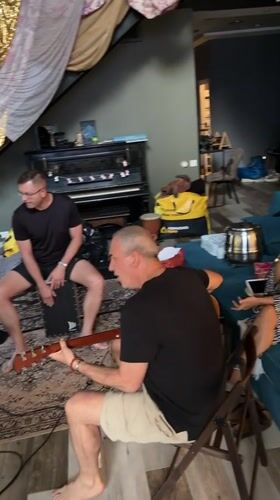 Band rehearsal in a bright Shebanovo room, guitars and keys