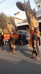 Traditional Javanese procession with Barongan mask in Batu streets