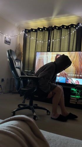 Person in gray hoodie documented in casual indoor moments