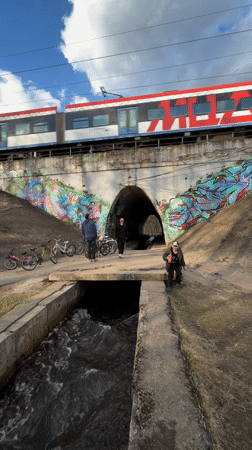 Cyclists gather at graffitied tunnel near Moscow