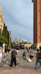 Routine street activity observed in Barcelona plaza and crosswalk