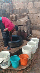 Dawn water collection and morning routines in Bukuru, Nigeria