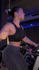 Woman exercises on stationary bike at Barcelona-area gym