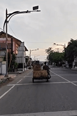 Evening traffic with cargo vehicles observed in Lhokseumawe, Indonesia