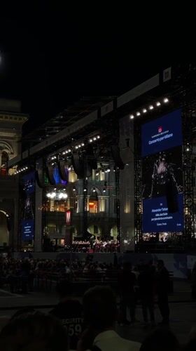 Evening orchestra concert in Milan cathedral square