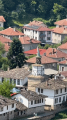 Morning views across a terracotta-roofed European hillside village