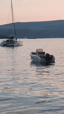 Bay of Kotor glows at sunset from Tivat's waterfront