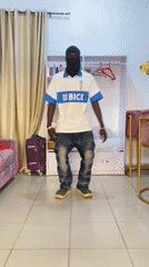 Masked dancer performs in Nigerian homes wearing BICE shirt