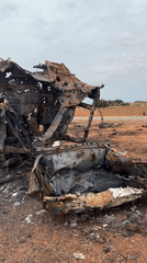 Destroyed vehicle and munitions visible in Um Laba, Sudan