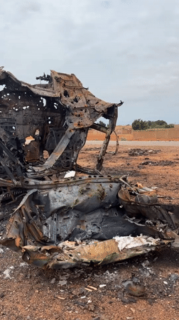 Destroyed vehicle and munitions visible in Um Laba, Sudan