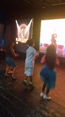 Children dance during late-night karaoke session in Porlamar