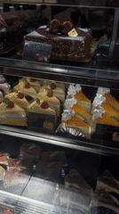 Customer tours 85°C Bakery display cases in Los Angeles