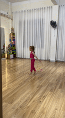 Girl practices jump rope, outdoor scene captured in Nha Trang
