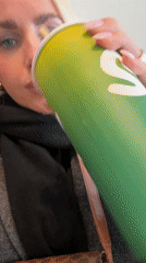 Woman enjoys Nutty Cacao smoothie at Oslo juice bar