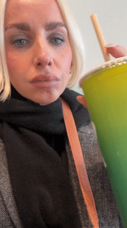 Woman enjoys Nutty Cacao smoothie at Oslo juice bar