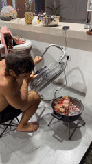 Man grills food outdoors while serving mojitos in North Kuta