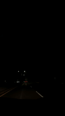 Late-night highway traffic and indoor TV viewing in Puebla area