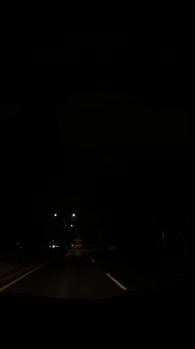 Late-night highway traffic and indoor TV viewing in Puebla area