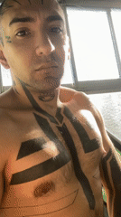 Tattooed man photographed taking bathroom selfies in Buenos Aires