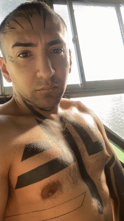 Tattooed man photographed taking bathroom selfies in Buenos Aires