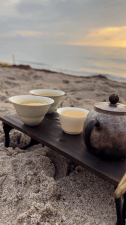 Beach tea ceremony and a yacht on calm Florida waters