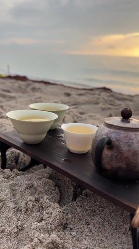 Beach tea ceremony and a yacht on calm Florida waters