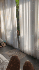 Person films legs from bed in North Kuta