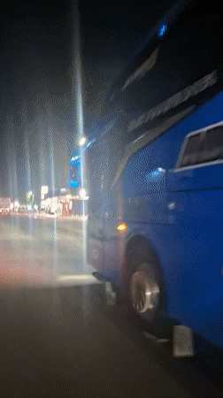 Commercial vehicles spotted on evening street in Keudebayu, Indonesia