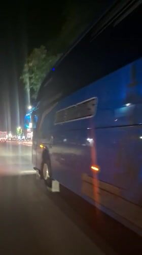 Commercial vehicles spotted on evening street in Keudebayu, Indonesia