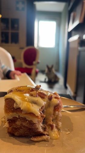 Afternoon cinnamon roll moment captured in German household