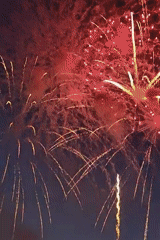 Evening fireworks display captured with rainbow sighting
