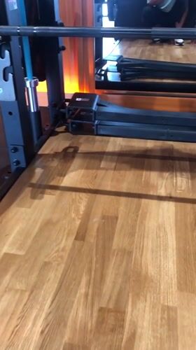Loaded barbell in a Krasnoyarsk gym squat rack