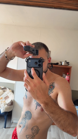 Mirror selfies with tattoos and red shorts, Boxtel