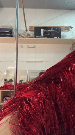 Performers prepare backstage in elaborate costumes in Kazan