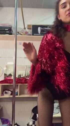 Performers prepare backstage in elaborate costumes in Kazan