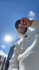 Man in hoodie photographed on sunny day in Strasbourg