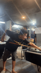 Evening pool session at a dimly lit billiards room in Tangerang