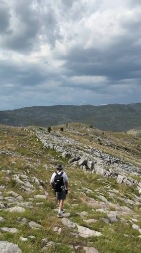 Solo hike through rocky mountain terrain in Bosnia