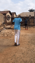 Young men exercise outdoors in Akwanga, Nigeria