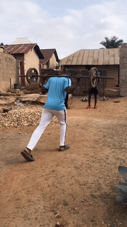 Young men exercise outdoors in Akwanga, Nigeria