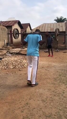 Young men exercise outdoors in Akwanga, Nigeria
