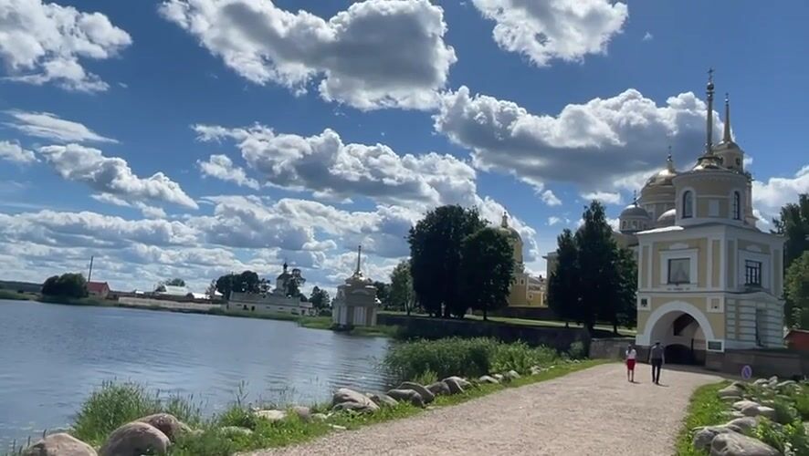 Sunny day on the Volga: monastery, boats, and a hang glider