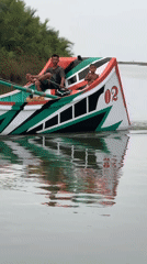 Colorful traditional fishing boats on the water in Reudeuep, Indonesia