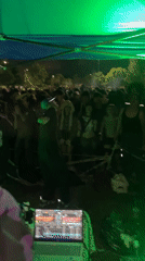 Outdoor DJ party documented in Buenos Aires nighttime event