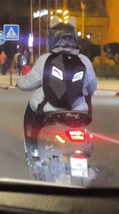 Scooter rider captured on video during Marrakesh night commute