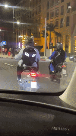 Scooter rider captured on video during Marrakesh night commute