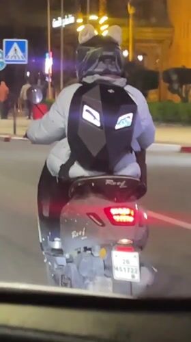 Scooter rider captured on video during Marrakesh night commute